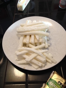 Blanched jicama batons, drying before being made into fries
